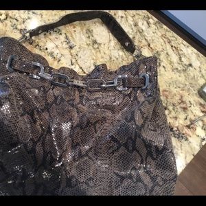 Snakeskin Tory Burch bag with silver hardware.